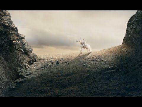 Gandalf crests the hill into Helm's Deep
